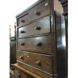 A 5 drawer pine framed chest of drawers.