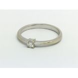 An 18ct white gold and diamond solitaire ring, app