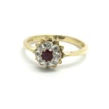 An 18ct yellow gold ruby and diamond cluster ring,