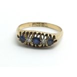 A 1930s 18ct yellow gold ring set with sapphires a