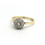 An 18ct yellow gold and diamond cluster ring, appr