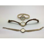 Three ladies gold watches.