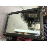 A large Arts & Craft mirror, approximately 64cm x