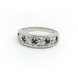 A 9ct white gold, sapphire and small diamond ring,