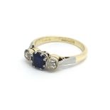 An 18ct yellow gold ring with central square sapph