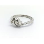 A 9ct white gold and three diamond ring, approx 0.