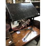 An adjustable cast iron work table.