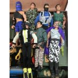 A suitcase of various Action Man figures and acces