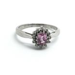 A 9ct white gold ring set with pink sapphire and d