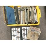 A box containing a collection of cigarette cards ,