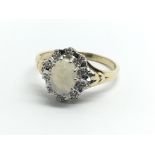 A 9ct yellow gold opal and diamond cluster ring, a