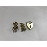 Three gold charms 9 ct 5 grams.