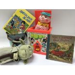 A collection of children’s toys and books includin