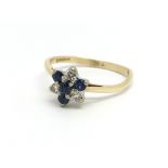 An 18ct yellow gold cluster ring having four sapph