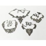 A collection of four marcasite necklaces of variou