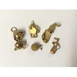 A collection of five gold novelty pendents some ma