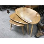 A nest of 3 vintage Ercol pebble tables.