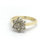 An 18ct yellow gold seven stone diamond ring in th