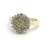 A 9ct yellow gold and diamond cluster ring, approx