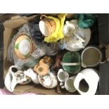 A box of various ceramic and glass items.