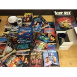 A collection of Star Trek novels and other items.