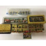 A collection of boxed plastic trackside people and