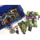 A box containing a collection of 90’s toys includi