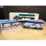 3 boxed Hess toys, a patrol car, rescue truck and