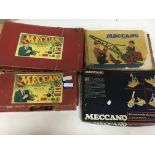 A box containing a collection of Meccano including