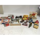 A collection of boxed Diecast and tinplate vehicle