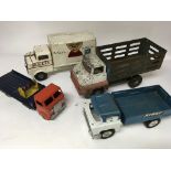 A collection of tinplate lorries including Triang,