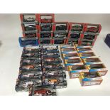 A box containing a collection of boxed Diecast veh