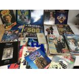 A collection of Dr Who books, magazines and comics