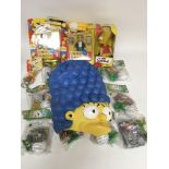 A collection of Simpsons Burger King figures and o