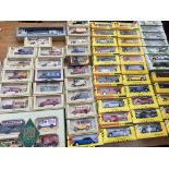 A box containing a collection of boxed diecast veh