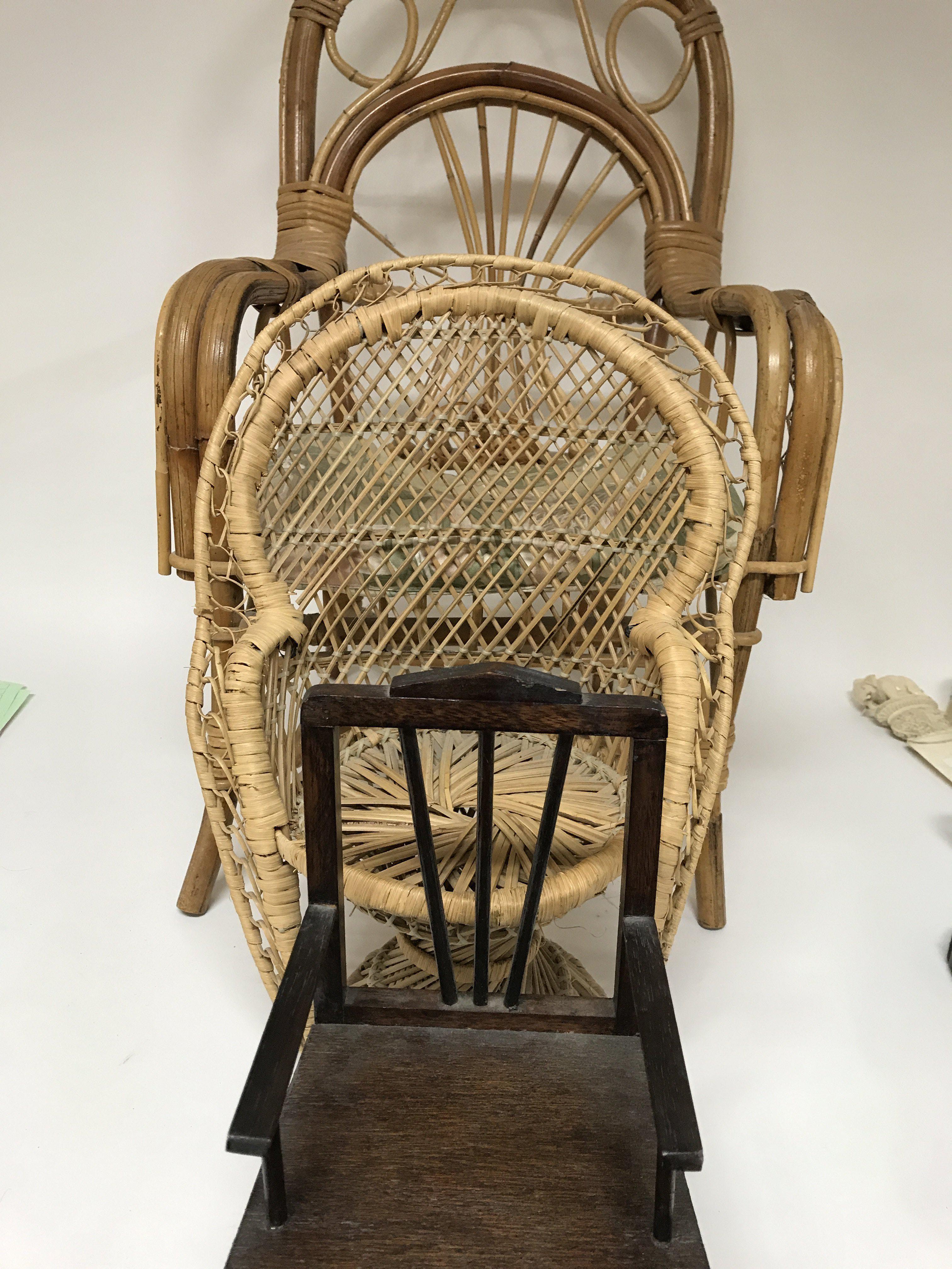Two small wicker chairs and a dolls rocking chair .