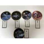 A collection of Hamilton Star Wars plates with cer