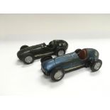Two vintage Scalextric racing cars.