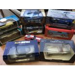 A collection of boxed diecast vehicles including 1