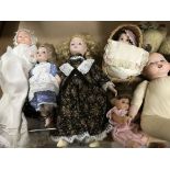 A collection of dolls and bears .