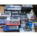 A box containing a collection of boxed diecast veh