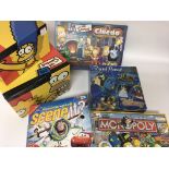 A collection of Simpsons Coalport and board games.