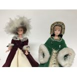 A collection of dolls in Tudor dress .