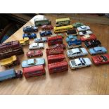 A collection of loose diecast vehicles including C