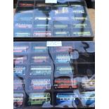 A collection of loose diecast buses including Corg