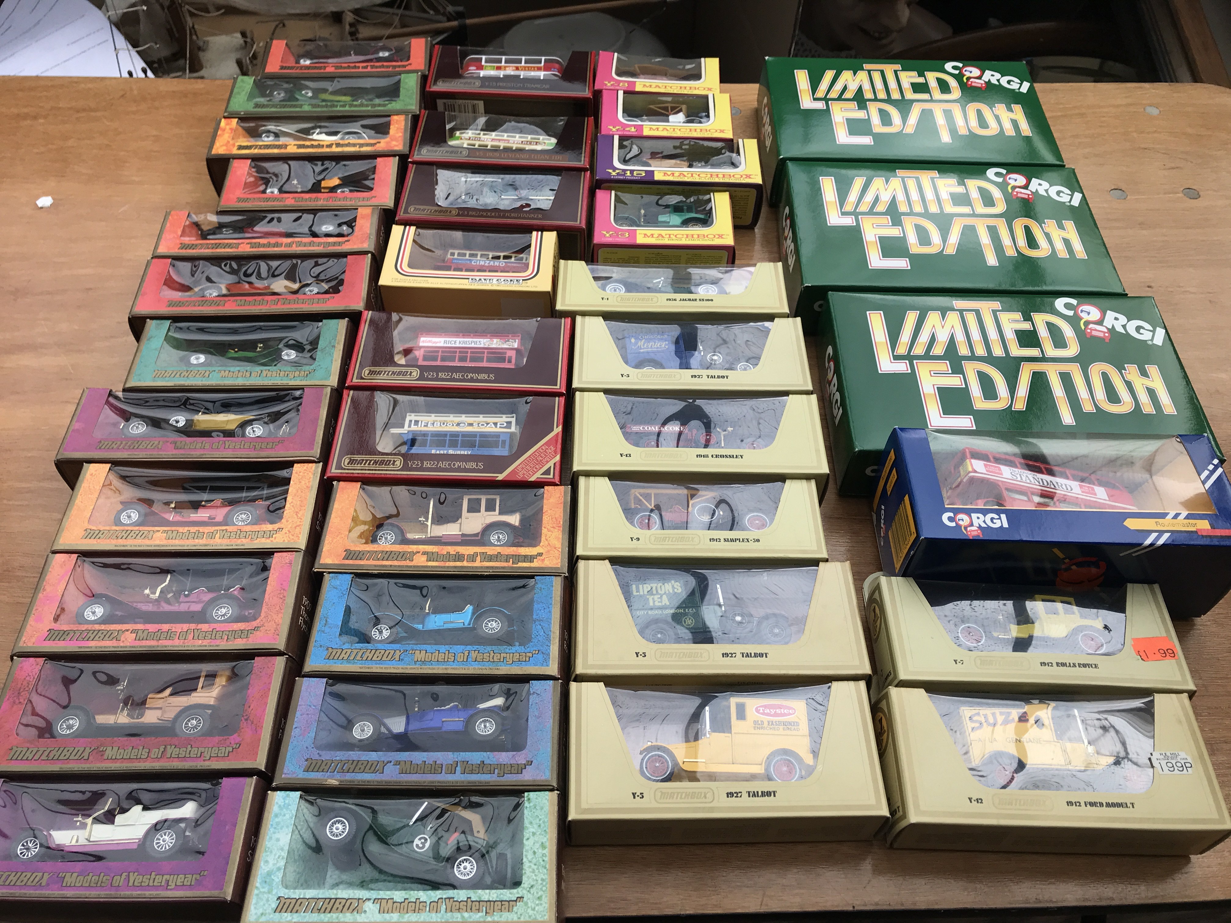 A box containing a collection of boxed diecast veh