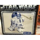 A collection of Star Wars plates and a R2-D2 cooki