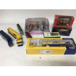 A collection of boxed and loose Diecast vehicles i