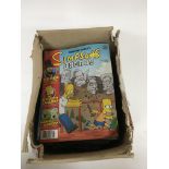 A box containing a collection of Simpson’s comics.