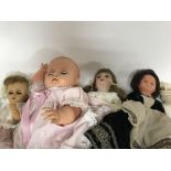 A collection of four dolls